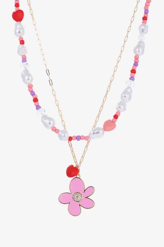 Collier superposé avec pendentif fleur et cœur