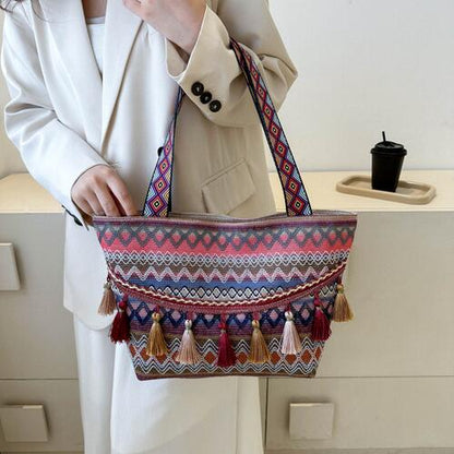 Bolso tote estampado con detalle de borlas