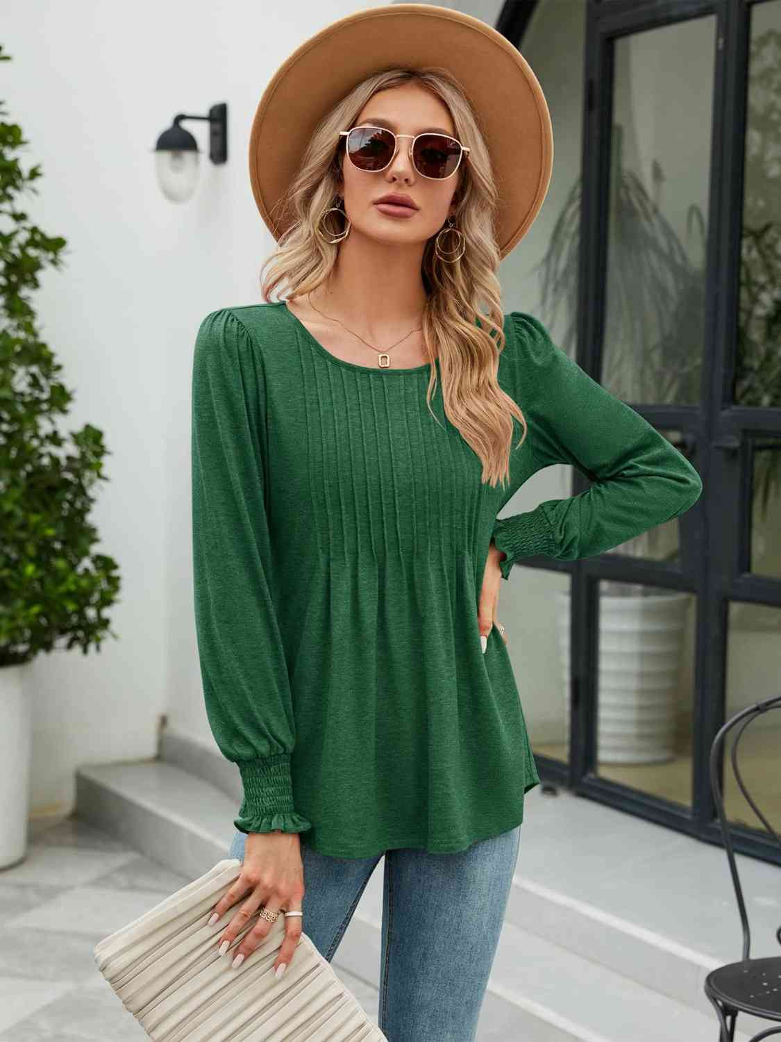 Blouse smockée à col rond et manches lanternes