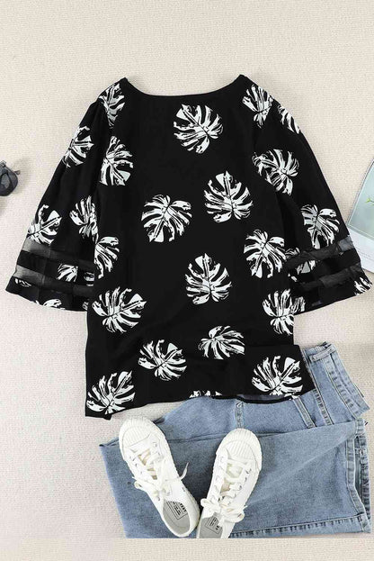 Blusa con manga abullonada y cuello en V con estampado botánico