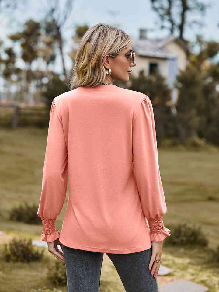 Blouse à manches volantées et col cranté