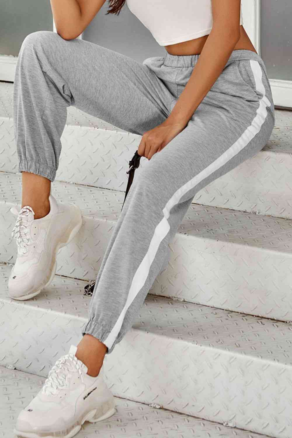 Joggers de rayas laterales con bolsillos