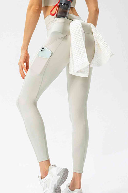 Pantalon de sport long taille haute coupe slim avec poches