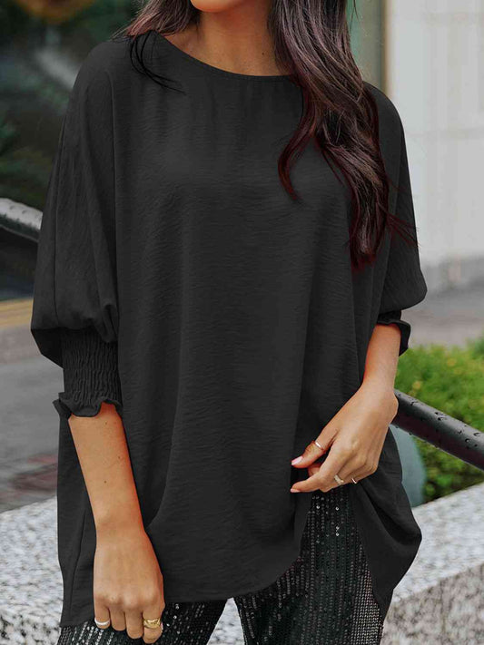 Blusa de manga tres cuartos con cuello barco