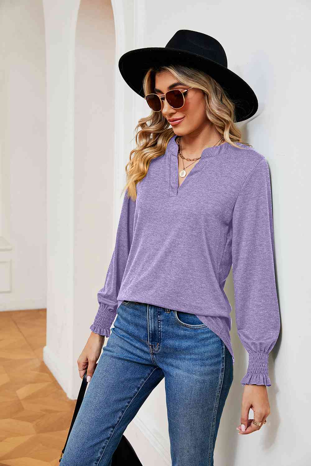 Blusa de manga larga con cuello con muescas