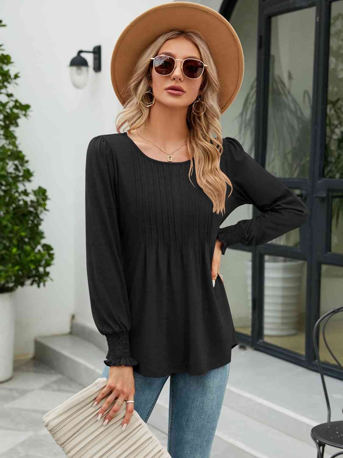 Blouse smockée à col rond et manches lanternes