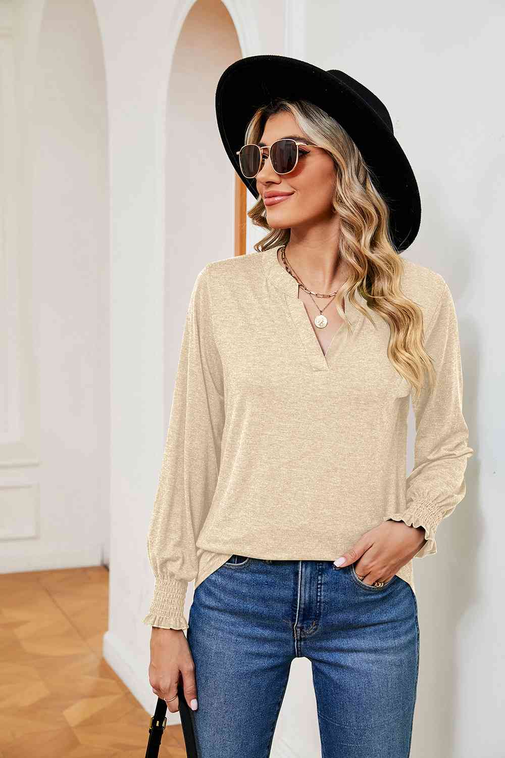 Blusa de manga larga con cuello con muescas