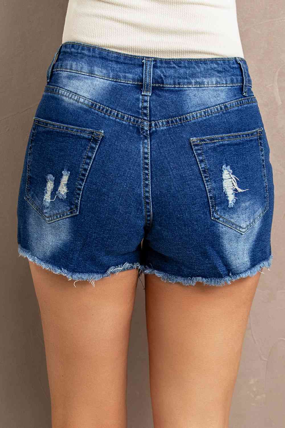 Shorts vaqueros desgastados con encaje empalmado