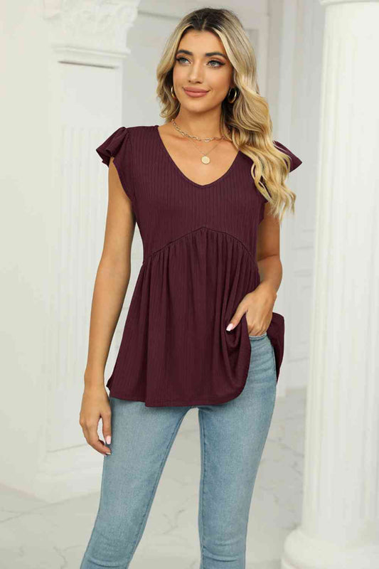 Blusa babydoll con mangas acampanadas y cuello en V