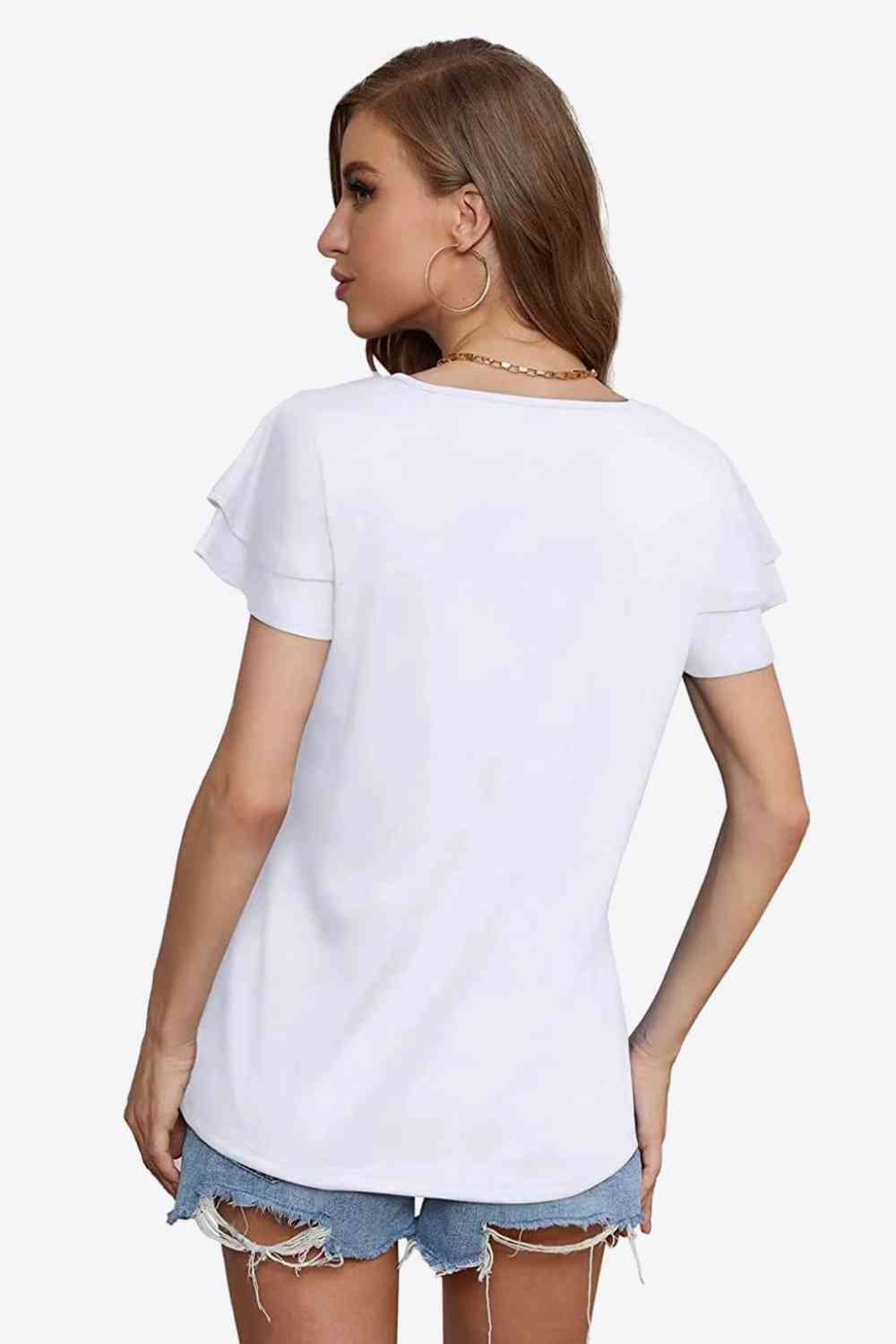 Blusa con mangas acampanadas y capas con cuello anudado