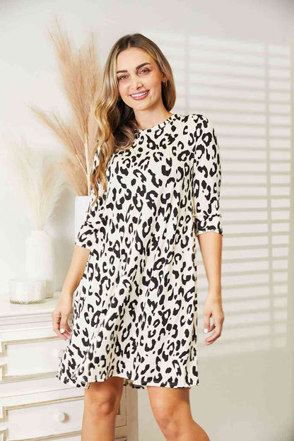 Celeste Vestido de manga tres cuartos de leopardo de tamaño completo con bolsillos