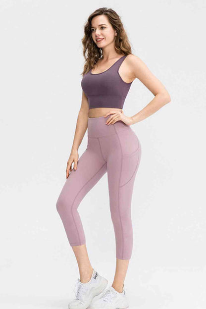 Leggings activos recortados con cintura ancha y bolsillos