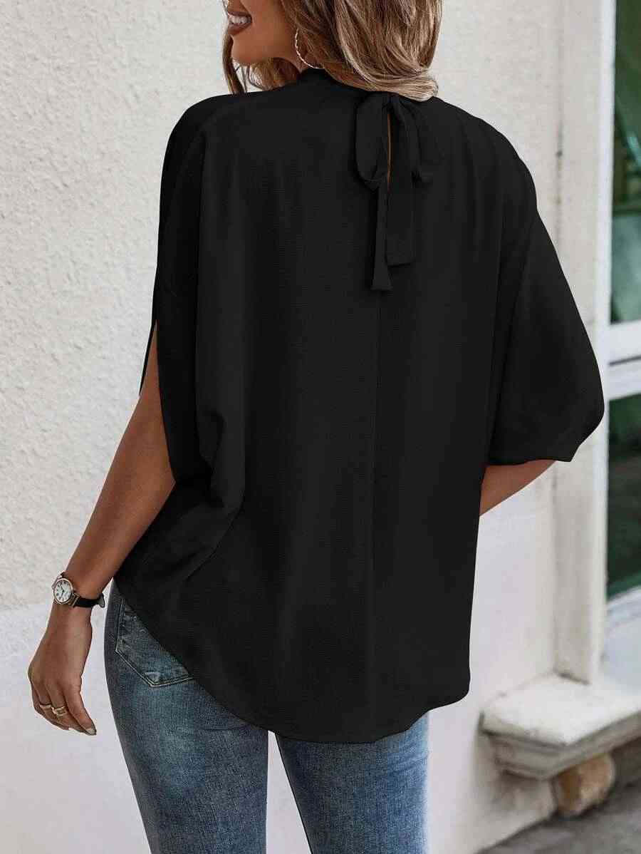 Blusa de manga con abertura y cuello redondo