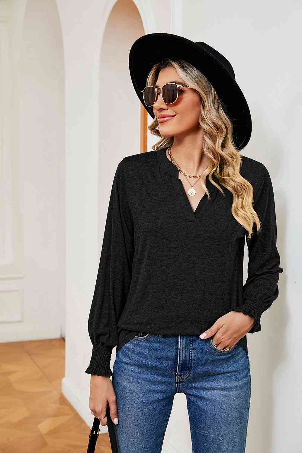 Blusa de manga larga con cuello con muescas