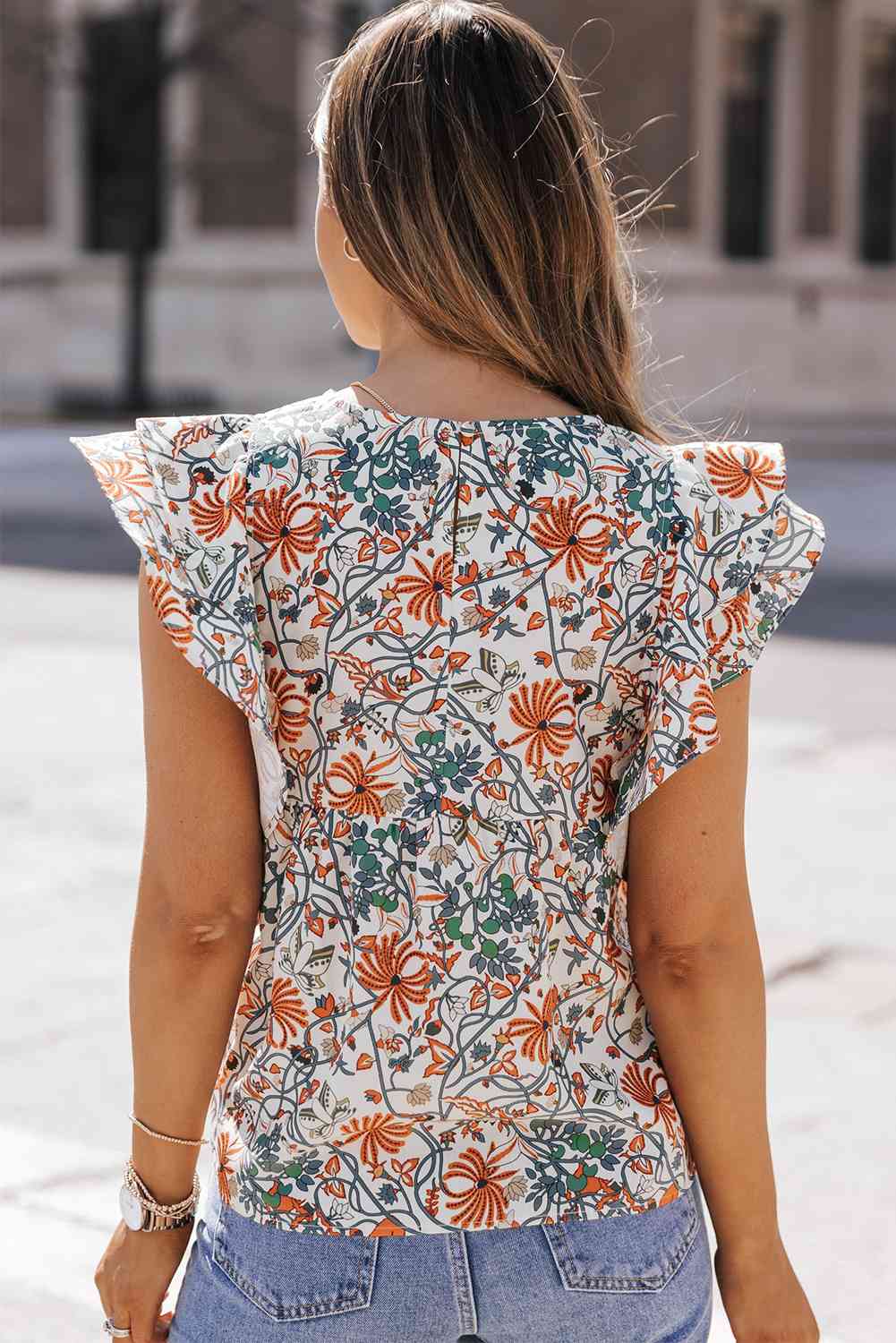 Blusa con cuello redondo y manga de mariposa estampada