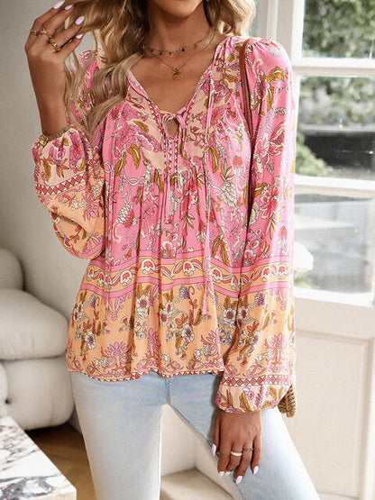 Blouse florale à manches bouffantes et col noué