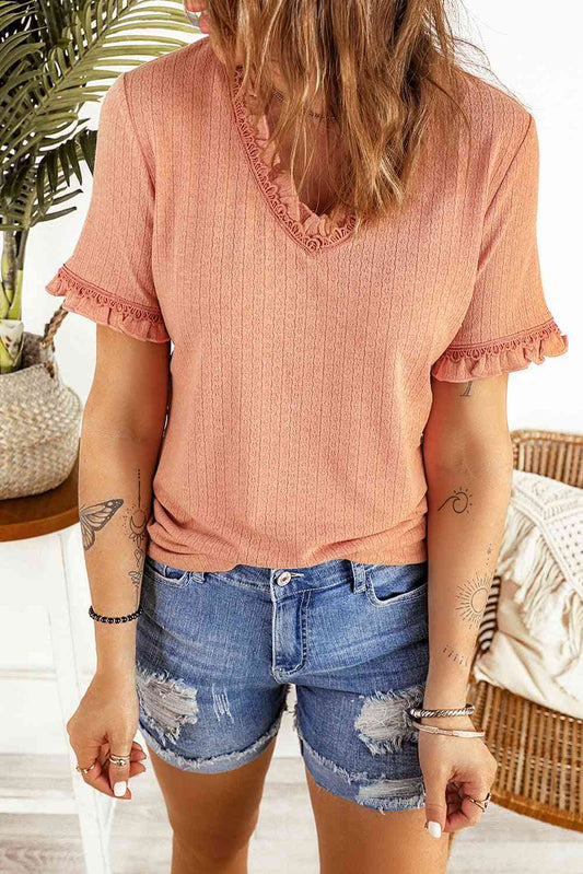 Blouse texturée à col en V et manches volantées