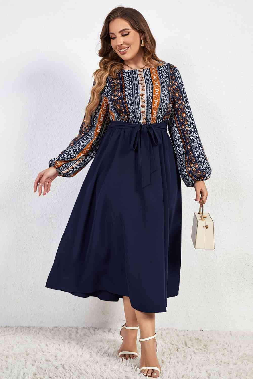 Melo Apparel Plus Size Printed Tie Belt Boat Neck Midi Dress