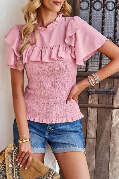 Blouse smockée à manches flottantes et nouée au dos