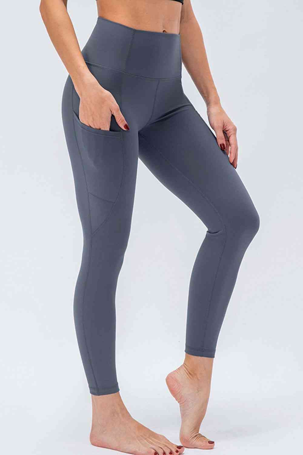 Leggings activos transpirables con cintura ancha y bolsillos