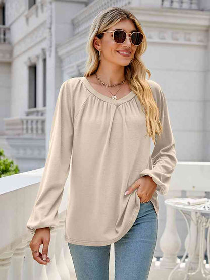 Blusa de manga larga con cuello en V