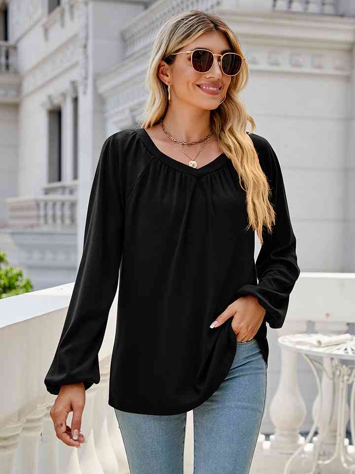 Blusa de manga larga con cuello en V