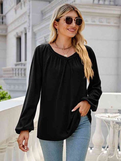 Blusa de manga larga con cuello en V