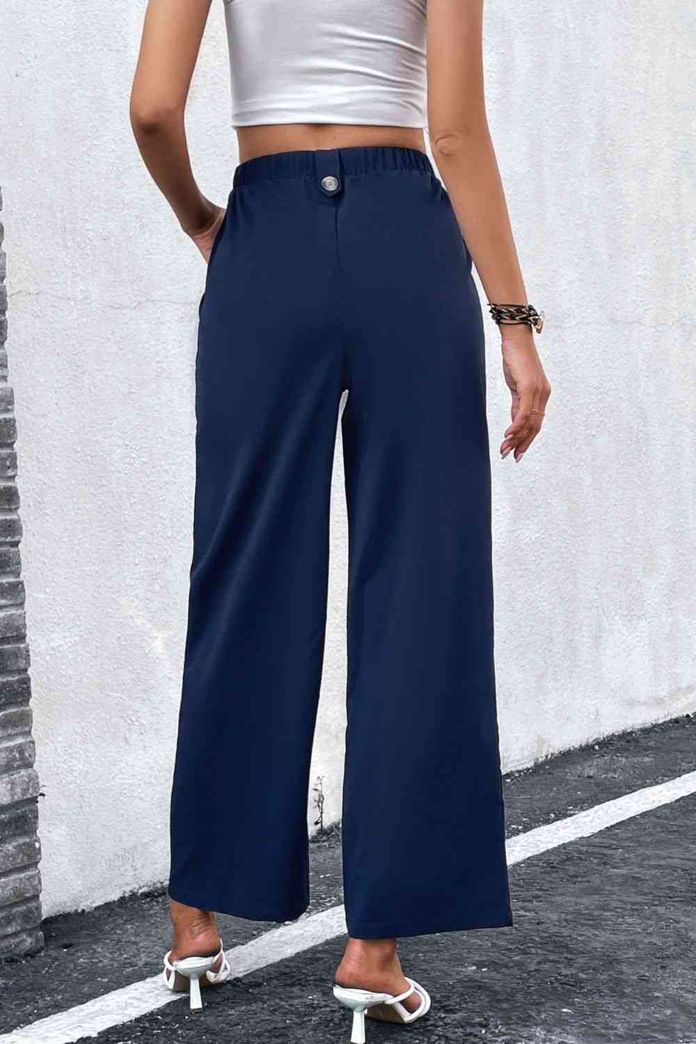 Pantalon large à taille haute plissée