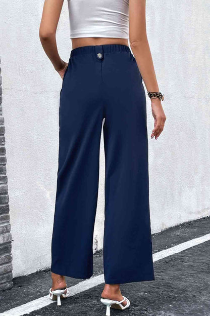 Pantalones anchos con cintura plisada y talle alto