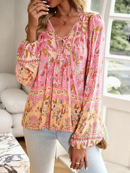 Blouse florale à manches bouffantes et col noué