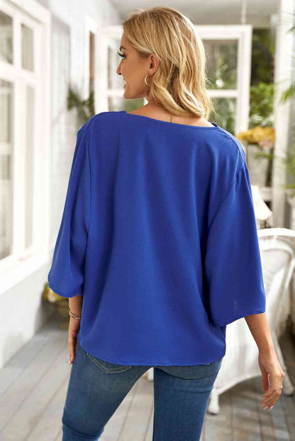 Blouse à col bénitier et manches trois-quarts