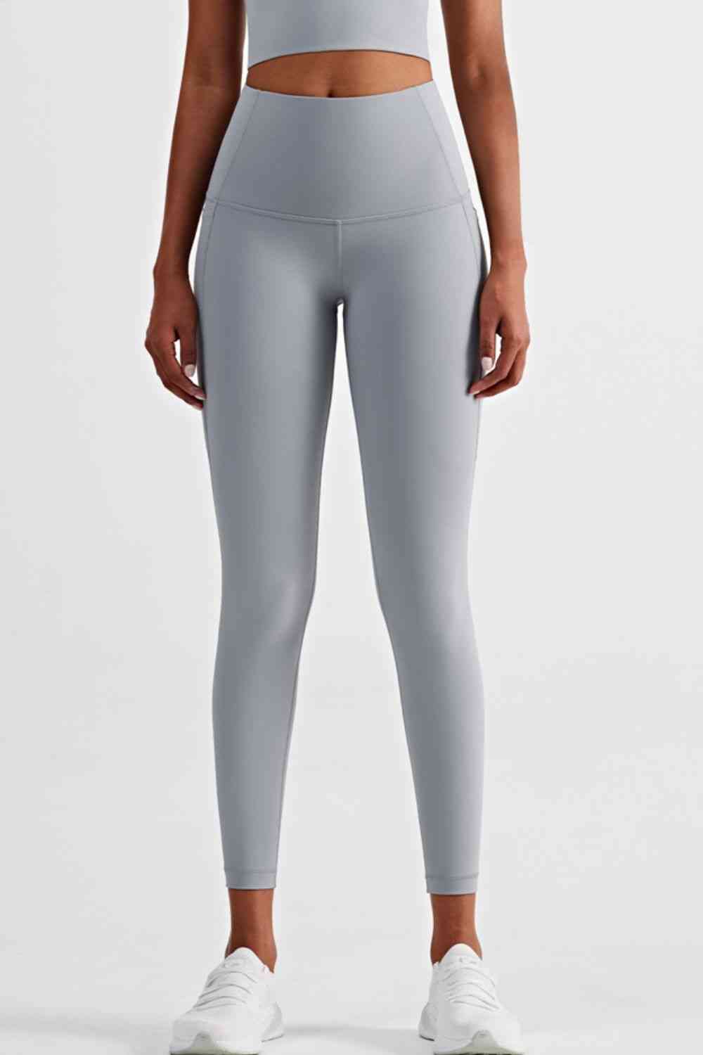 Leggings deportivos de cintura ancha con bolsillos laterales