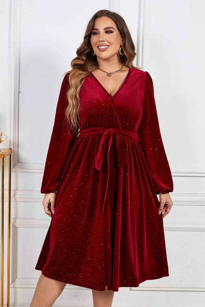 Melo Apparel Robe mi-longue à col surplis et manches ballon avec ceinture à nouer de grande taille