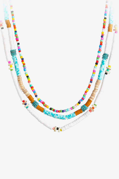 Ensemble de trois pièces avec collier de perles multicolores