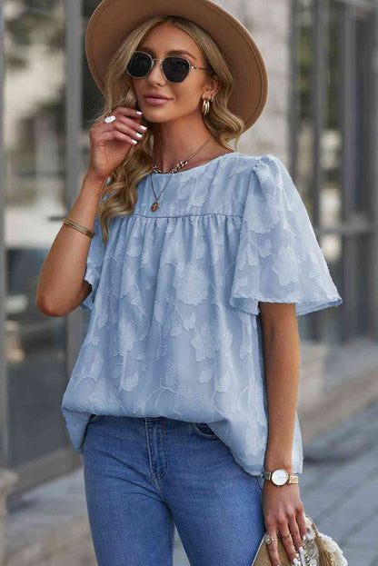 Blusa con cuello redondo y manga abullonada