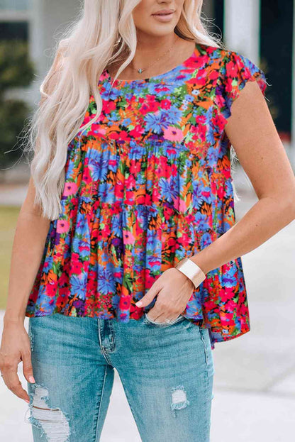 Blusa floral con cuello redondo y ribete de volantes