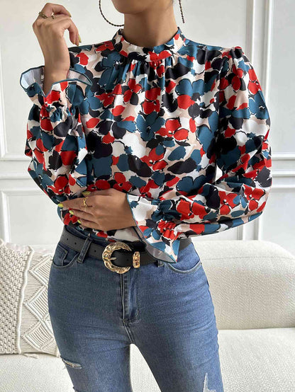 Blouse florale à col montant et manches longues à volants