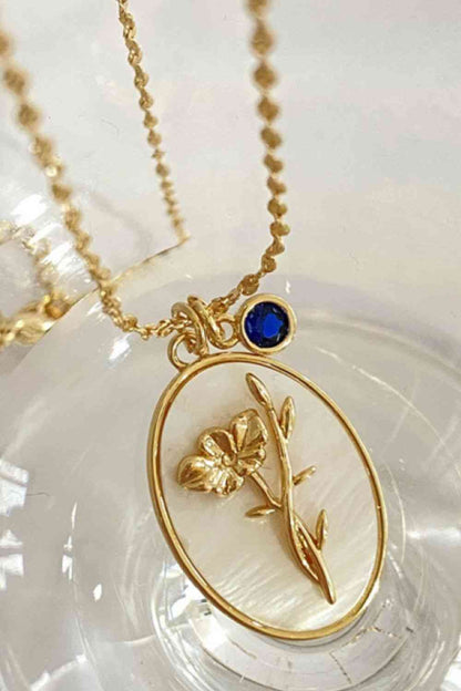 Collier en cuivre avec pendentif en forme de coquille de fleur