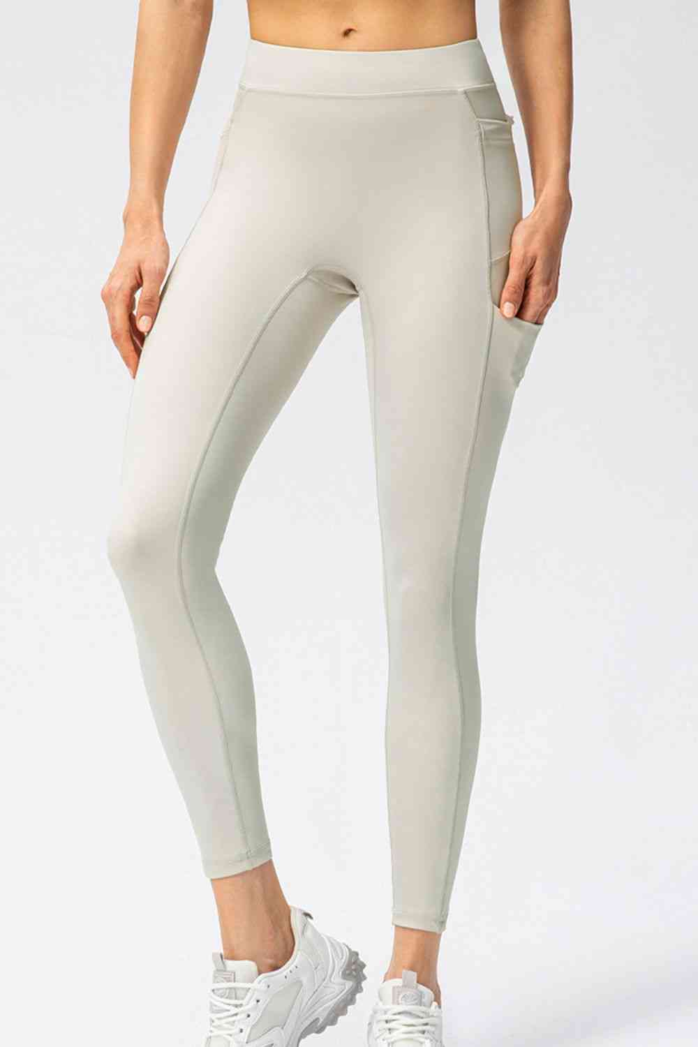 Pantalon de sport long taille haute coupe slim avec poches