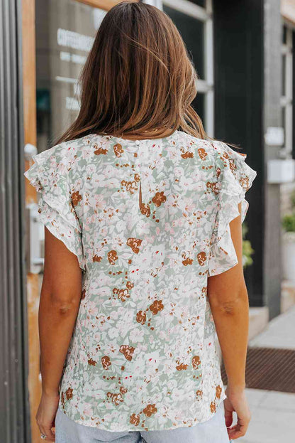 Blusa floral con mangas acampanadas y volantes