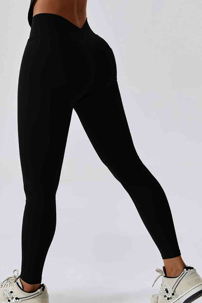 Legging de sport coupe slim avec large ceinture et poche arrière