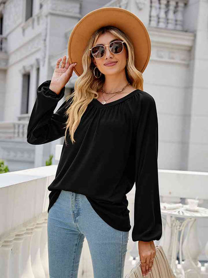 Blusa de manga larga con cuello en V