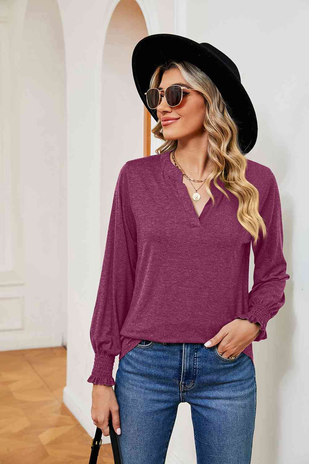 Blusa de manga larga con cuello con muescas