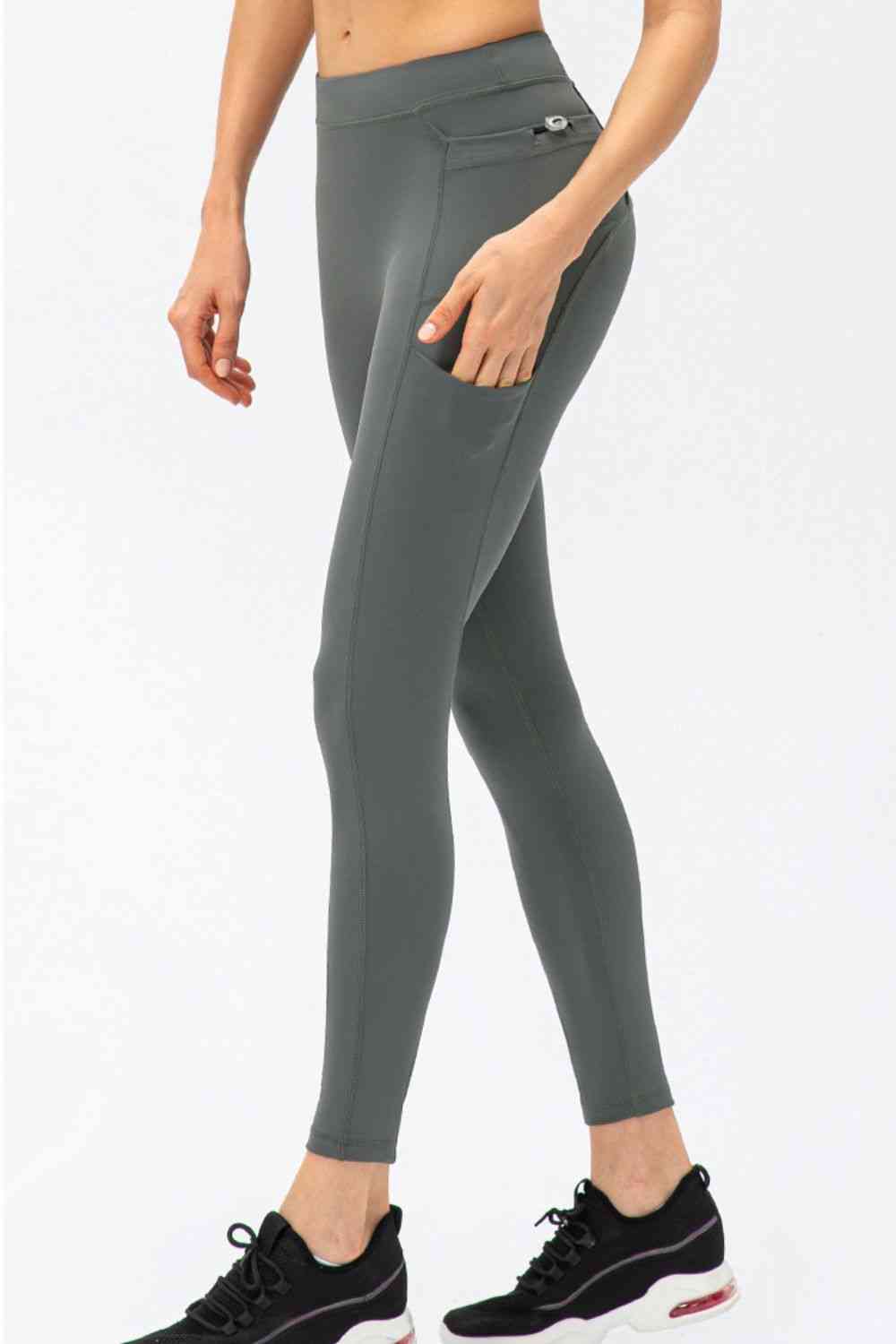 Pantalon de sport long taille haute coupe slim avec poches