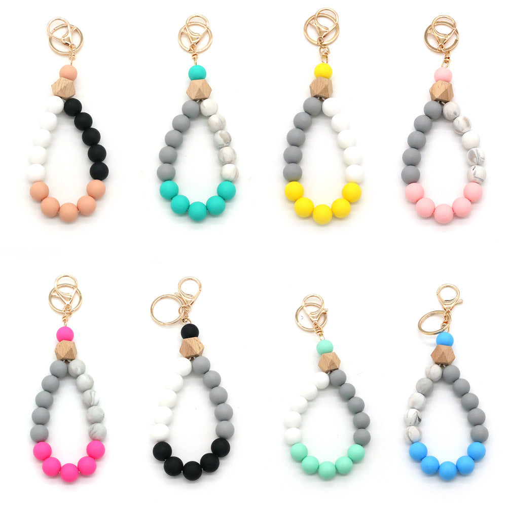 Assortiment de 2 porte-clés avec bracelet en perles multicolores