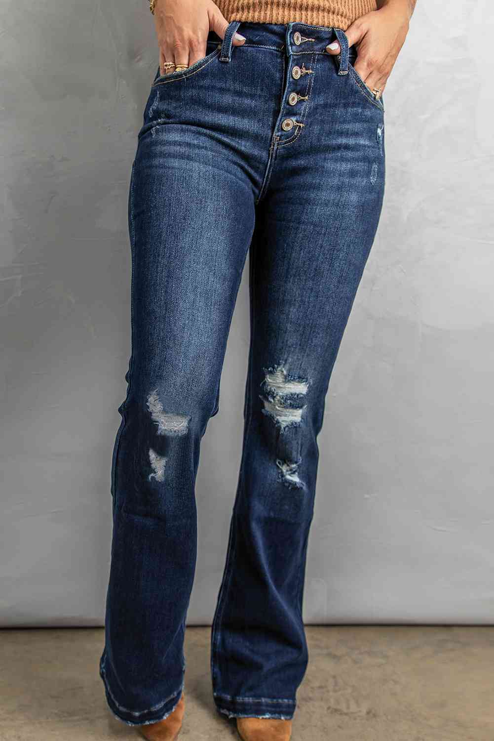 Jean bootcut effet vieilli avec braguette boutonnée