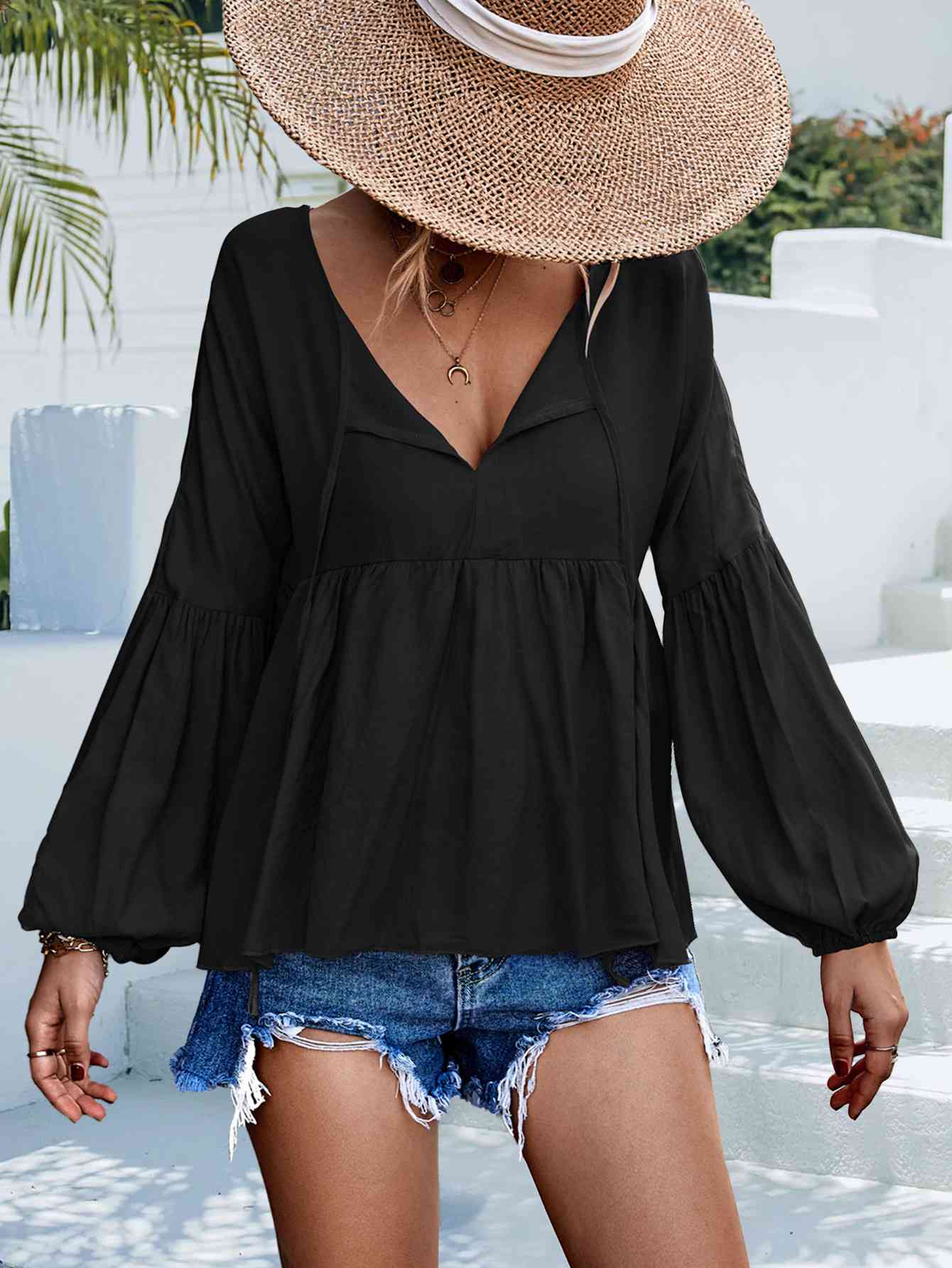 Blusa babydoll con mangas abullonadas