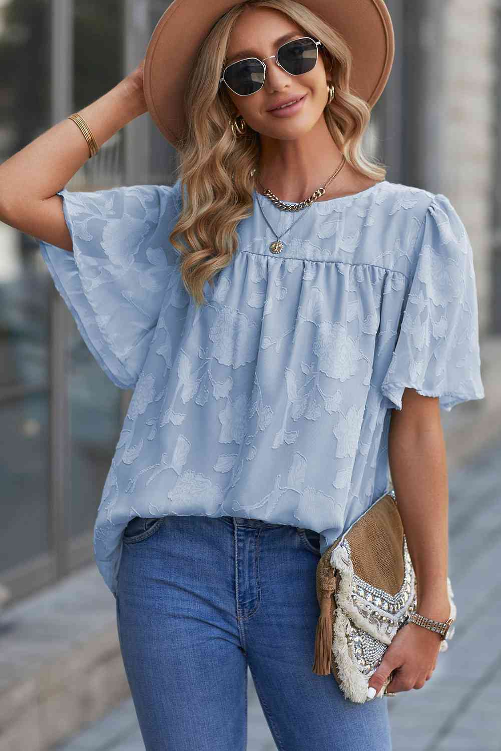 Blusa con cuello redondo y manga abullonada