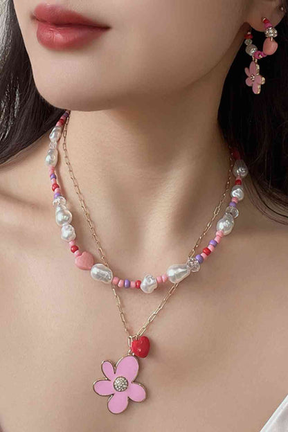 Collier superposé avec pendentif fleur et cœur