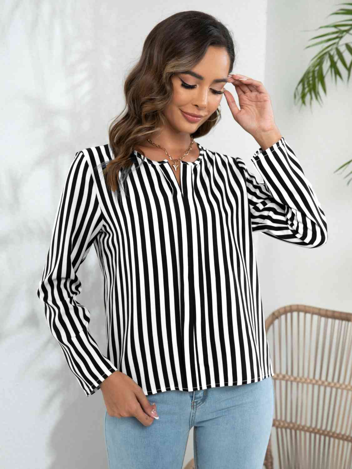 Blouse crantée à manches longues rayée